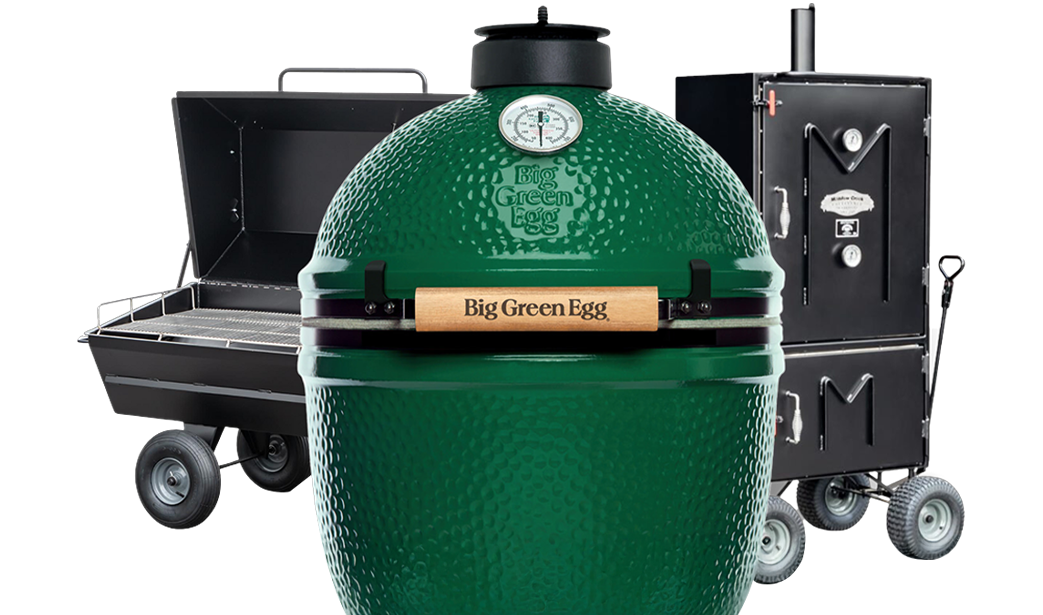 Old Country Smoker with smoke billowing out in rustic setting